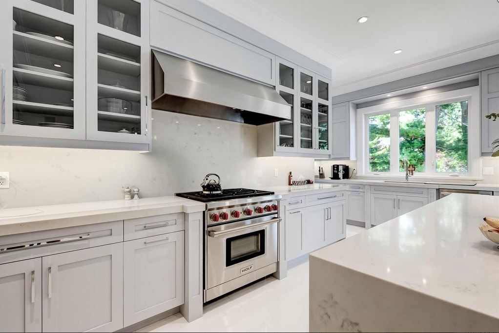 Custom white Kitchen with Stainless Steel Appliances
